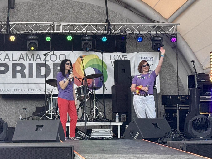 AG Nessel, Rep. Julie Rodgers on stage at Kalamazoo Pride