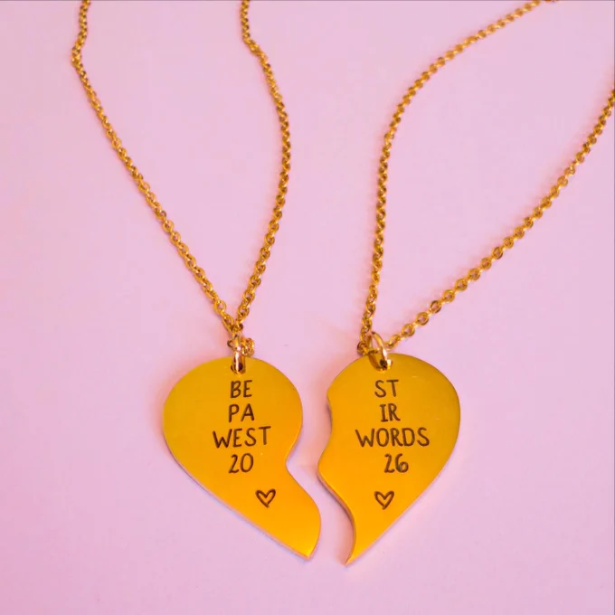 Nesting necklaces, the left necklace reads "BE / PA / WEST / 20", the right necklace reads "ST / IR / WORDS / 26"