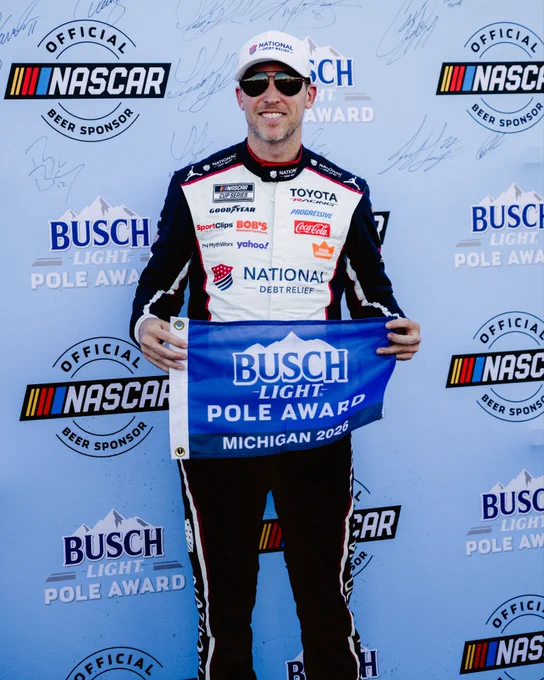 A photo of Denny Hamlin after winning the Busch Light Pole Award at Michigan International Speedway. 