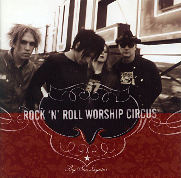 Album Art of The Rock 'N' Roll Worship Circus's Big Star Logistics album - A black-and-white, somewhat blurry photo of four young people in hoodies and T-shirts with rather crazy looks standing on top of a building with a large neon 'Hotel' sign behind them. The picture is a bit blurry with motion and and the bottom third is covered by a dark red background and a decorative line around the band's name in large, white block letters. At the very bottom in smaller, more decorative font is the album title and a small white star is right above it.