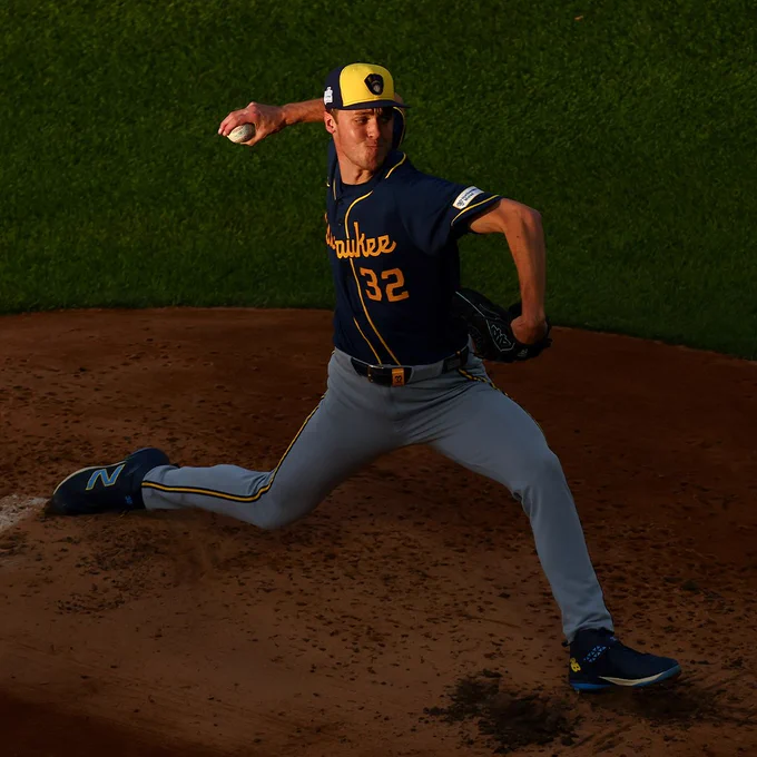 A high-angle shot of Jacob Misiorowski delivering a pitch during his start on Saturday night. He is wearing a dark blue Milwaukee Brewers jersey and a yellow and dark blue cap.