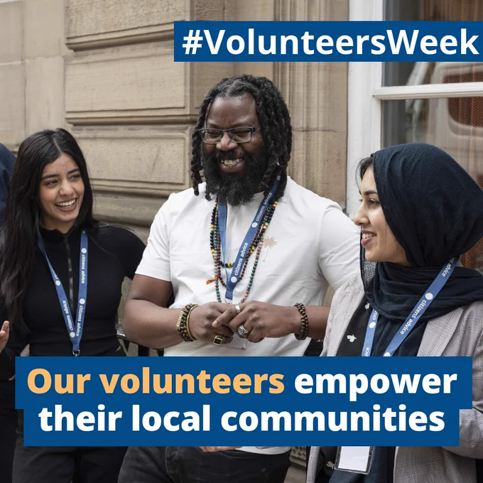 Citizens Advice volunteers in conversation and smiling outdoors wearing lanyards. Text below reads “Our volunteers empower their local communities” with hashtag #VolunteersWeek