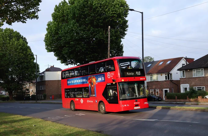 First Bus London BDE47196 (LF75OOA) is a red BYD BD11 and is pictured on Alexandra Avenue, South Harrow as it heads to Ruislip on route N118.