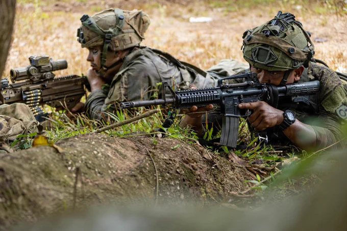 U.S. Army Spc. Tyler Sparks, left, an infantryman assigned to 2nd Battalion, 35th Infantry Regiment, 3rd Mobile Brigade, 25th Infantry Division, and Philippine Army Pvt. Lowell Furtono, assigned to 91st Brigade Reconnaissance Company, 1st Brigade Combat Team, observes their sector of fire during the Joint Pacific Multinational Readiness Center Exportable Exercise at Fort Magsaysay, Nueva Ecija, Philippines, May 19, 2026.