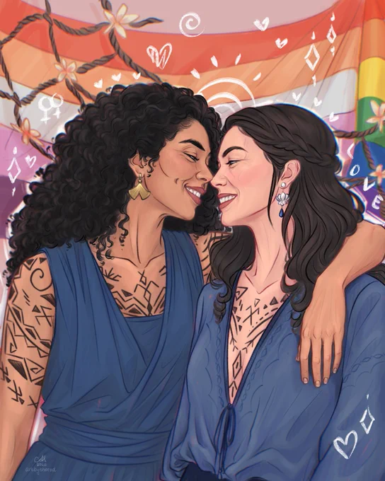 Digital fanart of Moiraine Damodred and Siuan Sanche from The Wheel of Time. The two women are shown from the waist up, standing close together with their noses touching and smiling at each other. Siuan is on the left, with dark curly hair, gold earrings, Tairen tattoos across her arms and chest, and a sleeveless deep-blue wrap-style dress. Her arm is around Moiraine’s shoulders. Moiraine is on the right, with long dark hair partly braided back, dangling earrings, Tairen tattoos across her chest, and a loose blue blouse with a tied neckline. Behind them is a lesbian and Pride flag backdrop, and dark ropes with small flowers hang across the upper background. White doodle-like hearts, spirals, diamond shapes, and other symbols are drawn around the figures.