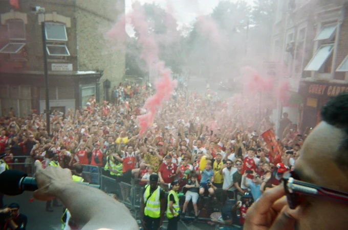 Arsenal supporters celebrate during the trophy parade