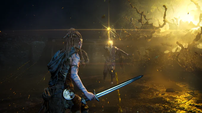 Senua, a celtic warrior, wields a sword with runes carved into its blade. She confronts a fantastical humanoid being wielding a golden staff. It appears to be preparing an attack.