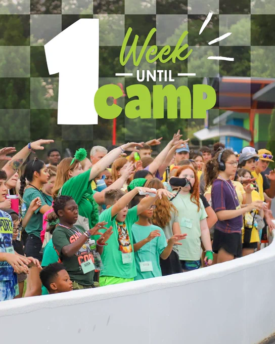 A crowd of Campers excitedly cheering behind the pit wall at a NASCARnival. The graphic reads “One Week until Camp”