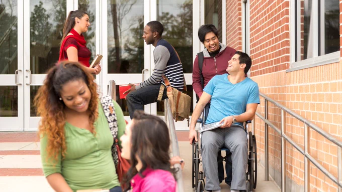 Image of a diverse group of high school students talking to each other outside of school.