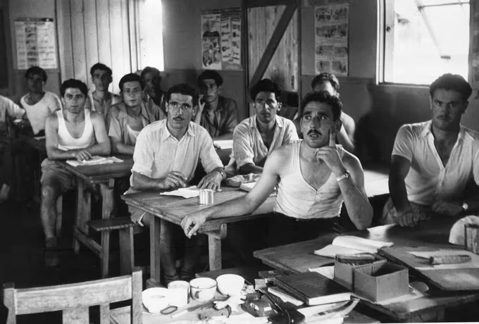 June 1954: Greek immigrants to Australia attend English lessons at the Bonnegilla Reception Centre near Alderbury, Victoria. 