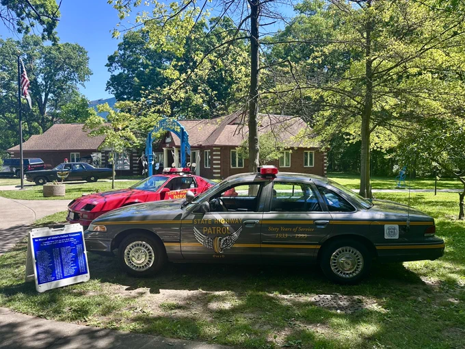 Three vintage OSHP cruisers parked on display at the Toledo Police Museum Cops and Rodders Car and Bike Show.