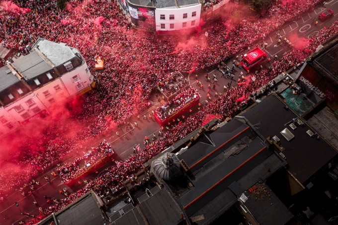 A birds eye view of the streets of north London packed with Arsenal supporters cheering on the bus during the trophy parade 