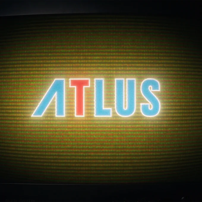 Image of the Atlus logo against a grainy screen.