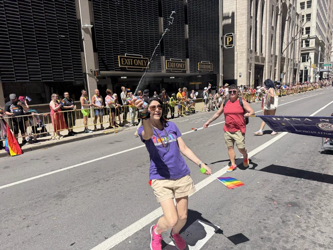 AG Nessel sprays silly string during parade