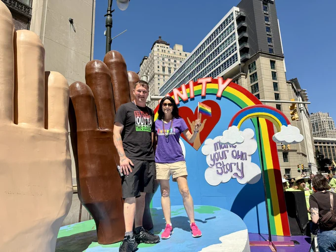 AG Nessel poses with parade-goer on Parade Co float
