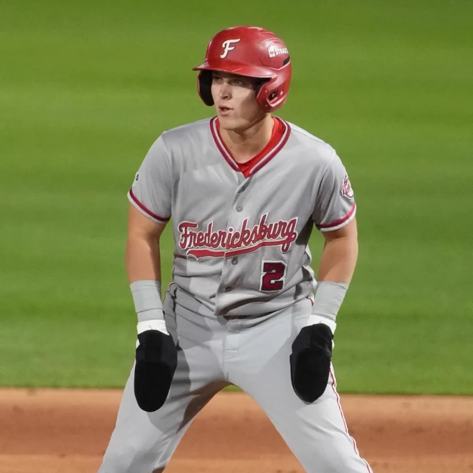 Eli Willits stands in a grey Fredericksburg Nationals uniform with black sliding gloves