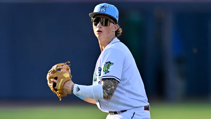Devin Fitz-Gerald fielding in a white Wilmington Blue Rocks jersey