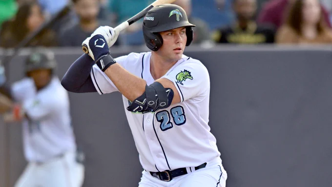 Ethan Petry batting in a white Wilmington Blue Rocks jersey