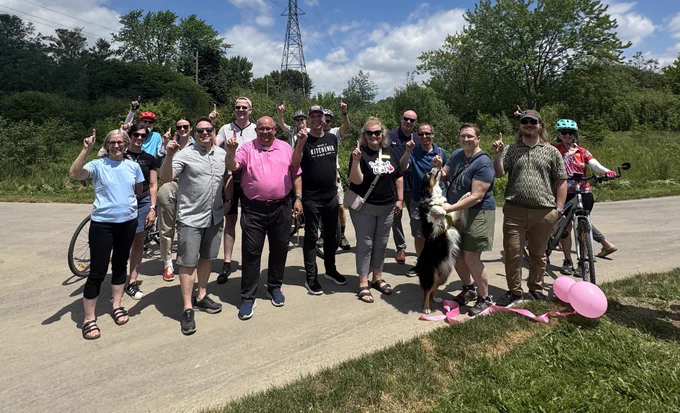 Council, staff, volunteers and community members celebrate the opening of Route 1