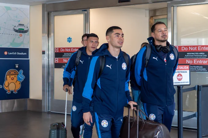 Players from Team Paraguay arrive at the airport in San José.