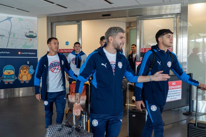 Players from Team Paraguay arrive at the airport in San José.