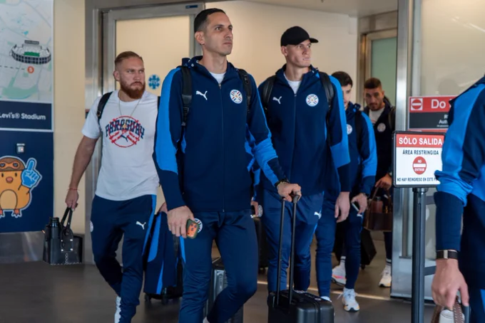 Players from Team Paraguay arrive at the airport in San José.