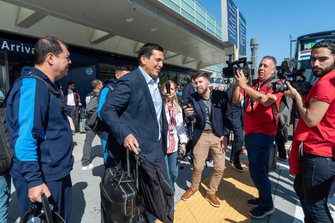 Members from Team Paraguay talk to local media representatives in San José.
