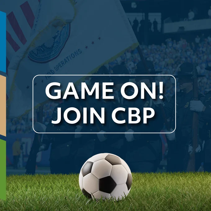 Soccer ball on grass with a background of CBP Honor Guard holding a flag in a crowded stadium. Game on! Join CBP.