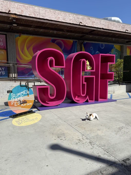 The SGF sign with a puppy dog laying in front of
