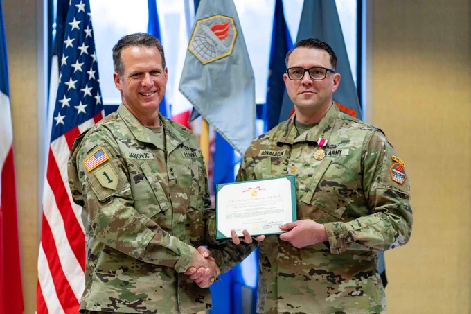 Maj. Gen. Ryan M. Janovic, Commanding General, U.S. Army Cyber Center of Excellence and Fort Gordon and  Maj. Todd Donaldson at the Headquarters and Headquarters Detachment (HHD), U.S. Army Cyber Center of Excellence,  CoC ceremony on June 4 , 2026. Photo by Staff Sgt. Xavier Legarreta, CCoE Public Affairs