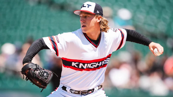Chicago White Sox prospect Hagen Smith pitches in a white Charlotte Knights uniform