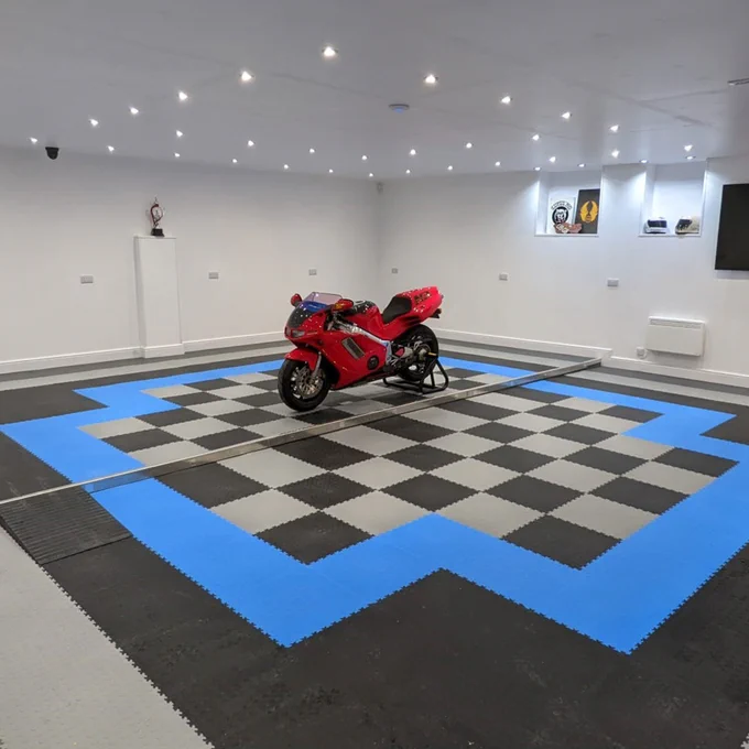 The MotoLock Recycled tiles are made from recycled PVC material, but look nearly like new PVC tiles. They are available at a lower price than the new PVC material tiles. The MotoLock Recycled design, fit and performance are the same as the standard MotoLock tile and they interlock with the new PVC MotoLock colour tiles / ramps for adding coloured edges or making floor patterns.