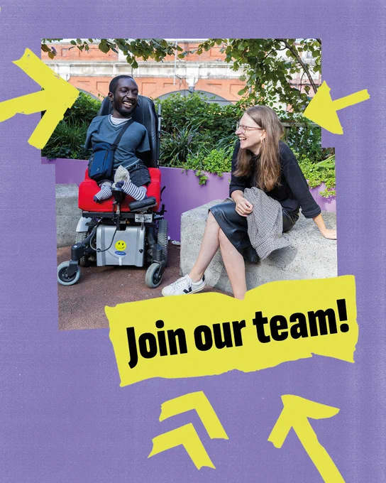 Two disabled people sitting in a city park. They are facing one another, laughing and grinning. One is a white woman in a leather skirt with long sandy hair. The other is a black man with a limb difference. The image has a jagged yellow frame. The words ‘join our team’ appear in bold underneath the picture on yellow tape. Matching yellow arrows point to the picture and words.