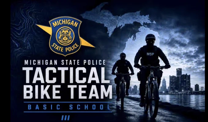 This is promotional banner with two Michigan State Police bicycle officers riding next to water with the state of Michigan in the clouds behind them. 