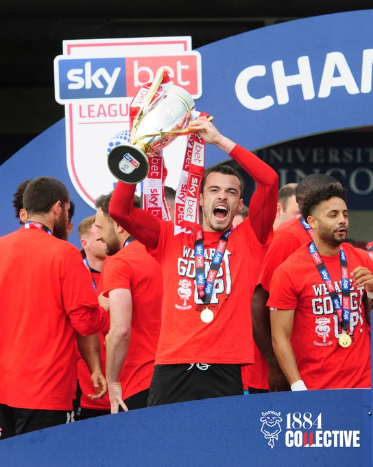 Harry Toffolo with the Sky Bet League Two trophy.
