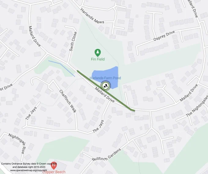 A digital map shows a residential area with several roads and houses. Notable locations include "Fin Field" and "Harlands Farm Pond." The map features roads like Mallard Drive and The Jays.