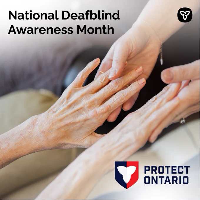 A person touching the hands of another person. Text reads: National DeafBlind Awareness Month.