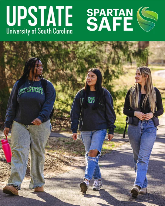 Image of three students walking together with a banner of the USC Upstate logo and Spartan Safe safety app logo.