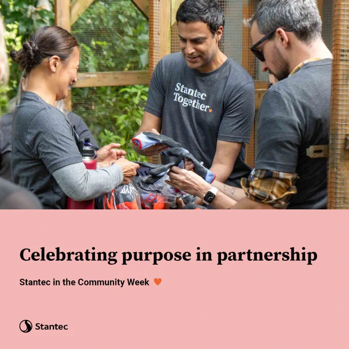 Three volunteers wearing 'Stantec Together' shirts organize supplies during a community event outdoors. Text overlay: Celebrating purpose in partnership. Stantec in the Community Week