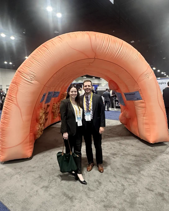 Drs. Hillary Johnson and Austin Hewitt stand together for a picture