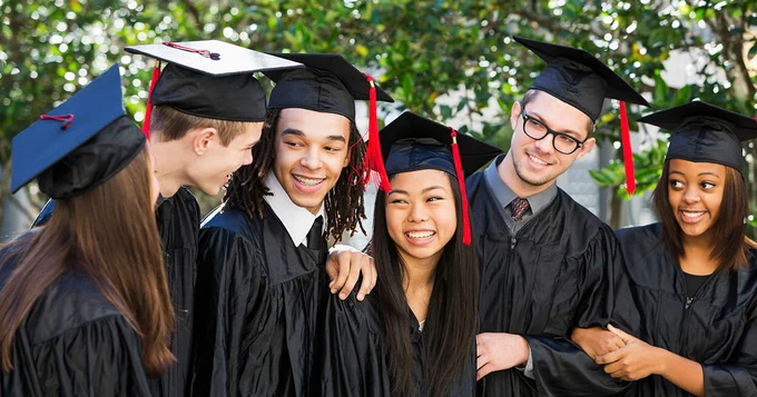 A group of students in caps and gowns.