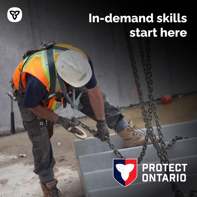 A construction worker attaching chains to concrete stairs