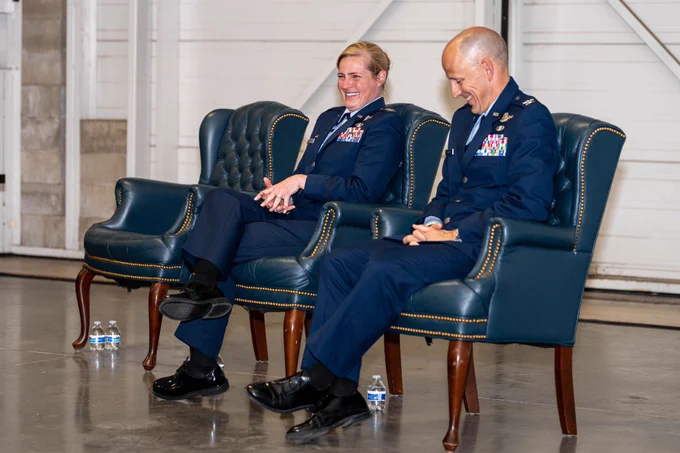 Two U.S. Air Force Colonels share a laugh during the 306 FTG Change of Command Ceremony at the U.S. Air Force Academy.