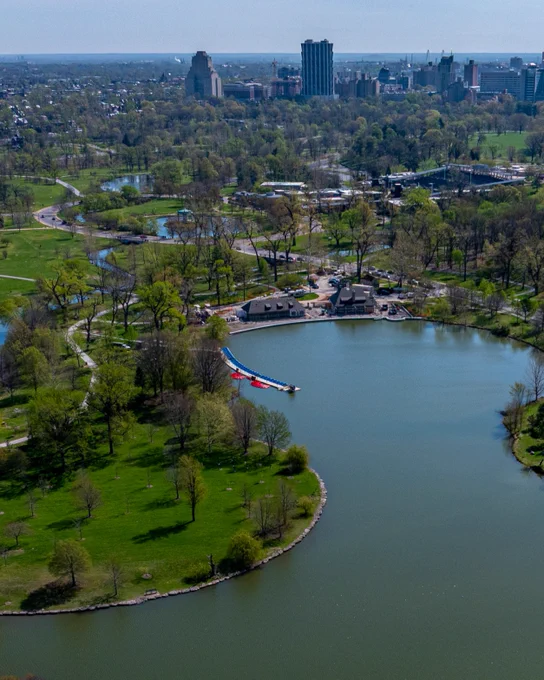 An aerial shows the relocated boat dock on Post-Dispatch Lake’s northern shoreline while the Boathouse restaurant and event space is under construction as the Saint Louis City skyline hovers in the distance.