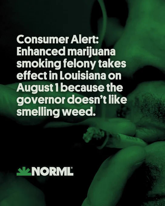 Close-up image of a lit marijuana joint being held near a person's mouth.