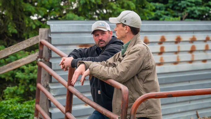 A photo of Rob Sand & Dave Muhlbauer standing on Dave's farm in Manilla, Iowa.