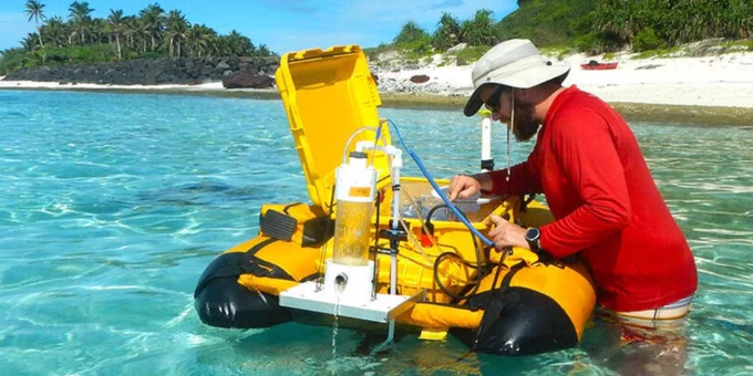 USGS physical scientist installs a special buoy in the waters of the National Park of American Samoa on Ofu in the Manuʻa Islands Group. The special buoy, developed by USGS scientists, measures radon on the reef, which is a marker of submarine groundwater.