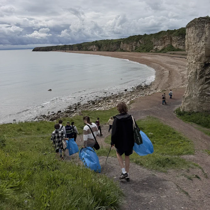 Volunteers enter the beach