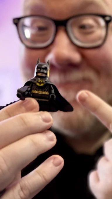 Selfie of me holding up a Lego Batman, mini Feig wearing the 1989 Batman costume