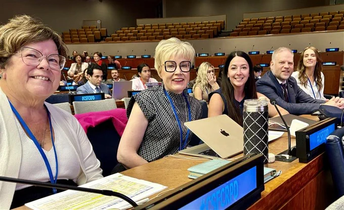 Image showing, Left - right President Moira Wilson (left), Krista Carr, Tara Levandier, Kurt Goddard, and Ainsley Wood.  All are seating in the UN General Assembly.